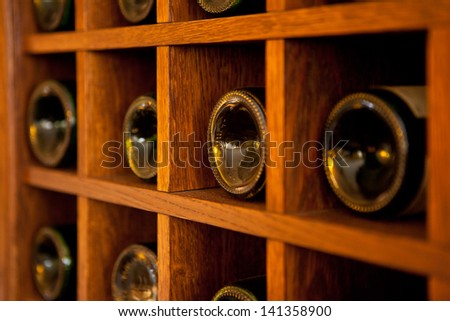 Wine Bottles rack. Wooden wine rack in the french restaurant
