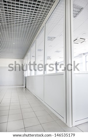 Empty office room with glass walls