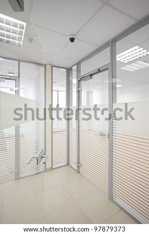 Empty office with glass walls and doors