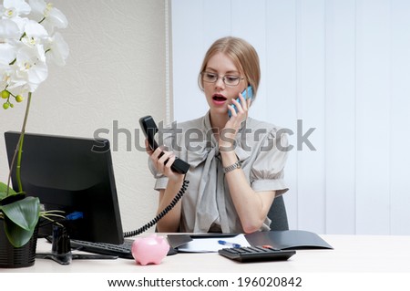 Busy business woman on landline phone call, listening to conversation