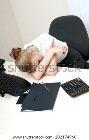 Tired young  businesswoman  sleeping at work.