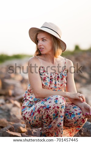 Similar – Image, Stock Photo Charming woman on stony coast