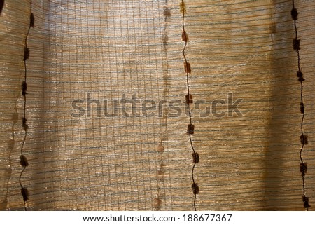 Abstract bright fabric background Golden tones with light