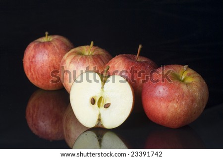 for whole apples in a row, with a half apple in the front