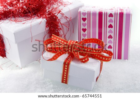 three presents with bows and ribbons