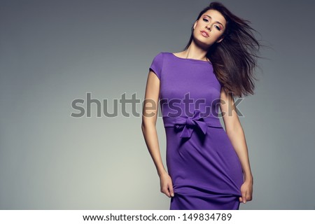 picture of young beautiful woman wearing purple dress