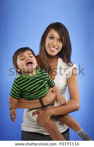 Happy Teenage Mom and Crying Baby