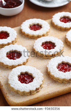 Raspberry Linzer Torte Cookies on Cutting Board
