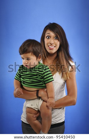 Overwhelmed and Stressed Out Teen Mom with Baby