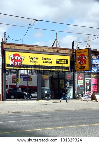 TORONTO - APRIL 21: A Money Mart location on April 21, 2011 in Toronto. Money Mart currently owns 412 stores across Canada with an additional 53 franchised stores.
