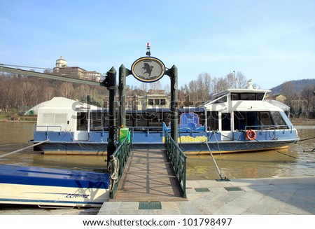 TURIN - MARCH 7: A ferry at a dock on the Po river on March 7, 2012 in Turin. The Po river flows 682 km eastward across northern Italy. The river flows through many important cities, including Turin.