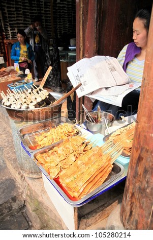 CHONGQING - MARCH 19: A street food vendor on March 19, 2012 in Chongqing. According to the Food and Agriculture Organization, 2.5 billion people eat street food every day.