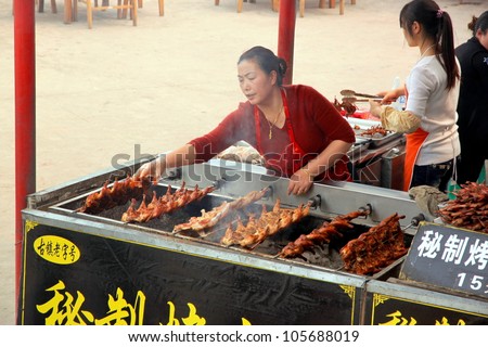 CHONGQING - MARCH 19: A street food vendor on March 19, 2012 in Chongqing. According to the Food and Agriculture Organization, 2.5 billion people eat street food every day.