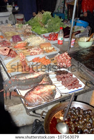 FENGHUANG - MARCH 22: Traditional street food on March 22, 2012 in Fenghuang County. According to the Food and Agriculture Organization, 2.5 billion people eat street food every day.