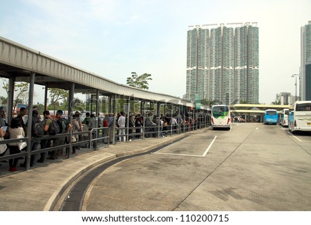 HONG KONG - MARCH 31: A line of people at a bus terminal on March 31, 2012 in Hong Kong. In Hong Kong, over 90% of daily travels are on public transport, the highest percentage in the world.