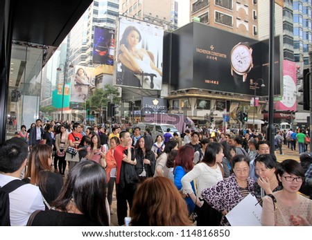 HONG KONG - APRIL 3: People queuing outside a clothing store on April 3, 2012 in Hong Kong. In Hong Kong, for companies, there is a 17.5% corporate tax, which is lower than international standards.