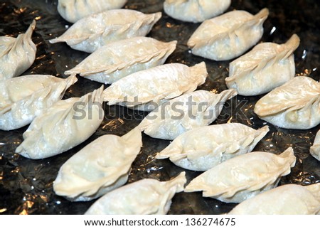 TORONTO - APRIL 15: Chinese dumplings on April 15, 2013 in Toronto. Chinese Jiaozi (dumplings) are one of the major foods eaten during the Chinese New Year and year round in the northern provinces.