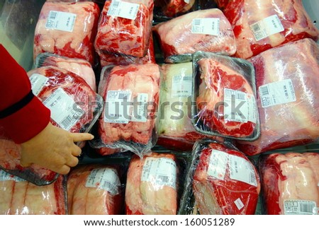 TORONTO - OCTOBER 13: Packaged beef in a supermarket on October 13, 2013 in Toronto. Beef is the third most widely consumed meat in the world, accounting for about 25% of meat production worldwide.