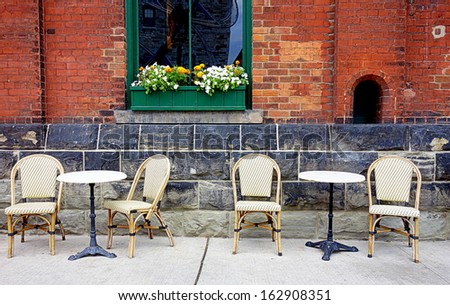Retro bar tables and chairs outside a cafe