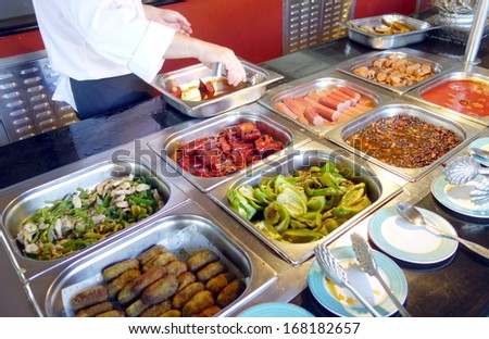 VARADERO, CUBA - NOVEMBER 30: Selection of Cuban food at a restaurant on November 30, 2013 in Varadero, Cuba. Being colonized by Spain, the main influence on Cuban cuisine is from Spain.