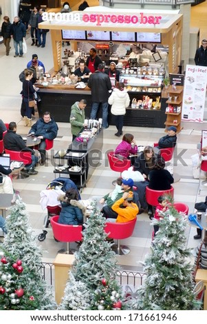 TORONTO, CANADA - DECEMBER 24, 2013: People at the Fairview Mall for the last hours of Christmas shopping. Fairview Mall is a major shopping centre in Toronto, Ontario, Canada
