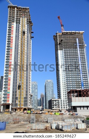 TORONTO, CANADA - APRIL 8, 2014: Buildings under construction in Toronto. Toronto\'s boom has helped lead to development of more high rise buildings in 2011 than any other city in North America.