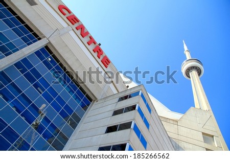 TORONTO, CANADA - APRIL 2, 2014: The Rogers Centre and CN Tower in Toronto. The Rogers Centre (originally known as SkyDome) is a multi-purpose stadium in downtown Toronto, Ontario, Canada.