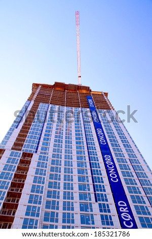 TORONTO, CANADA - APRIL 2, 2014: Modern condo buildings in Toronto. Toronto\'s boom has helped lead to development of more high rise buildings in 2011 than any other city in North America.