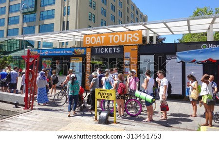 TORONTO, CANADA - AUGUST 9, 2015: People lining up awaiting for a water taxi in Toronto, Canada.