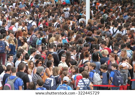 MILAN, ITALY - MAY 29, 2015: Crowd lining up to access Expo exhibition in Milan, Italy.