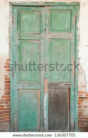 Old door in a crumbling building