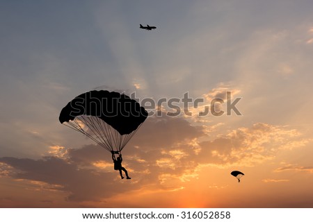 Similar – Image, Stock Photo paragliding man with orange paraglider against the sun