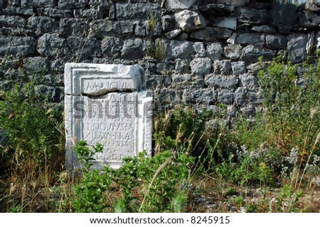 Roman epitaph in old town Docle near the city Podgorica in state Montenegro.
