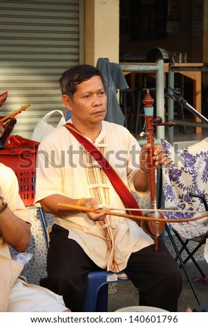 CHIANG MAI,THAILAND-JUNE 1 : Thai elderly traditional northern musician band at Sunday walking street market, It is thai tradition exhibition to the tourists ,On June 1, 2013 in Chiang Mai, Thailand.