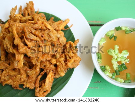 deep fried sajor-caju mushroom patty or mushroom cake serve with vegetable soup