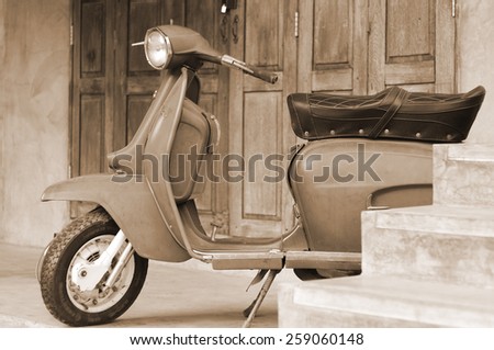 CHIANG MAI,THAILAND-FEB22 : old vespa parked in front of a house for show (post process to be sepia style picture).,On Feb 22, 2015 in Chiang Mai, Thailand.