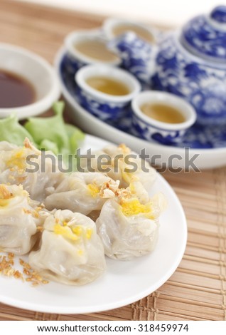 Chinese steamed dumplings. rice or wheat dough enclosing minced meat and steamed. Chinese snack.