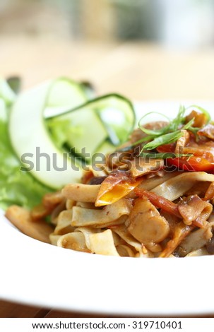 linguine pasta with tomato sauce. pasta with thai style tomato sauce. pasta. fusion food. fusion pasta menu.