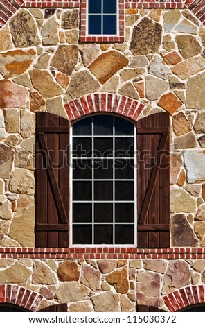 Window on stone wall of southern home
