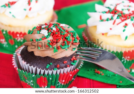 Holiday cupcakes with red and green sprinkles. Closeup with shallow depth of field.