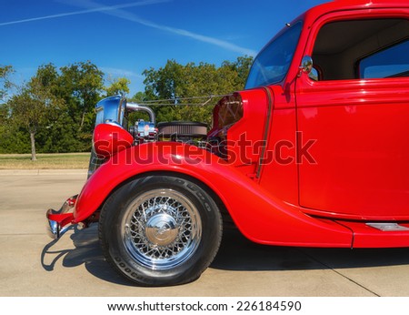 WESTLAKE, TEXAS - OCTOBER 18, 2014: A red 1935 Ford pickup truck is on display at the 4th Annual Westlake Classic Car Show. Closeup of front side.