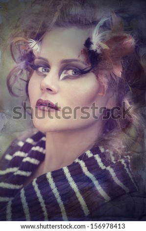 Vintage portrait of a beautiful, charming and pretty girl with art makeup in modern fashion style