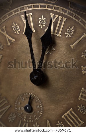 Old clock with roman numerals. Selective focus on number XII.