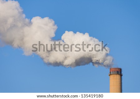 smokestack releasing pollution on clear blue sky - easy to create mask