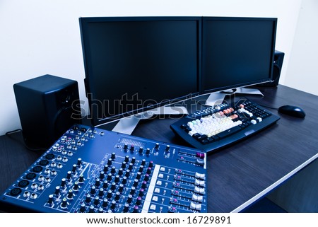 editing station with audio mixer and dual monitor