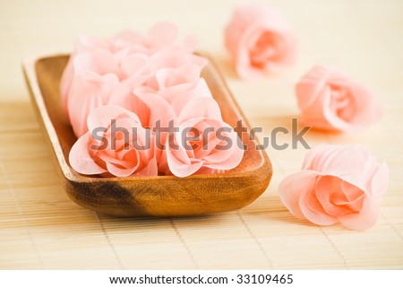 rose flowers made from soap in wood tray