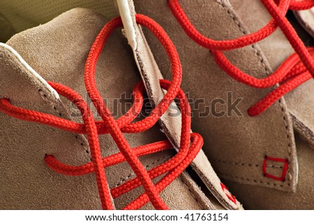 closeup shot of winter shoes with red shoe lace
