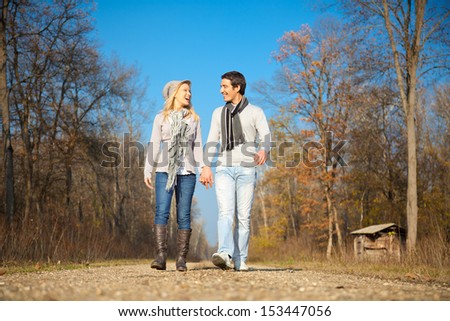 Romantic young beautiful couple on autumn walk. Autumn set.