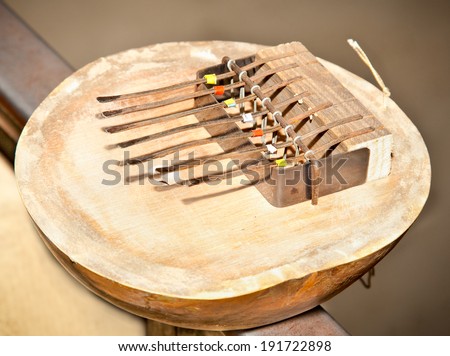 Kalimba 7 note, African Instrument (native and tribal) made of wood and coconut with seven pieces of steel. Kenya, Africa.