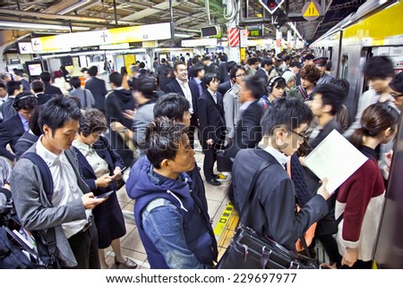 TOKYO, JAPAN - OCTOBER 28. 2014: Passengers hurry at Akihabara crowd station in Tokyo, Japan.   Akihabara is one of the world's few Electric Towns